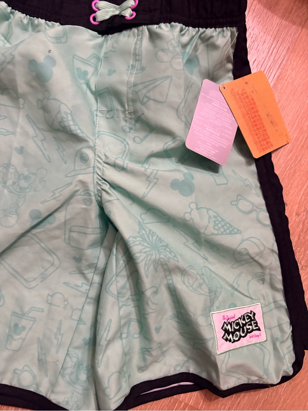 Disney Mint Green Swim Shorts with Black Waistband and Pink Accents